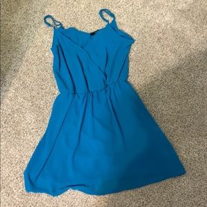 Blue crossover at neckline dress